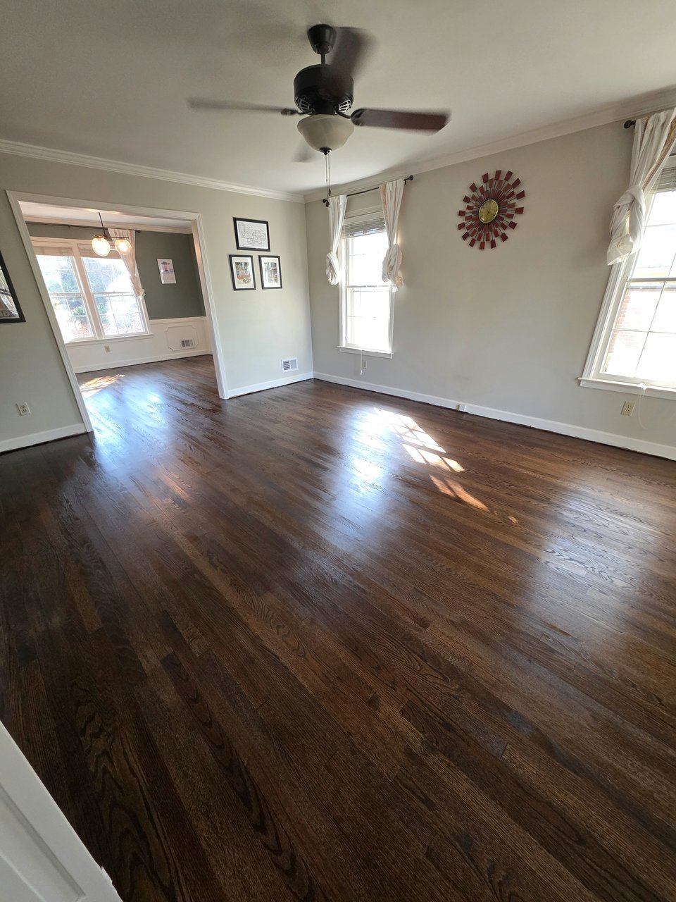Dark flooring in a bright living room