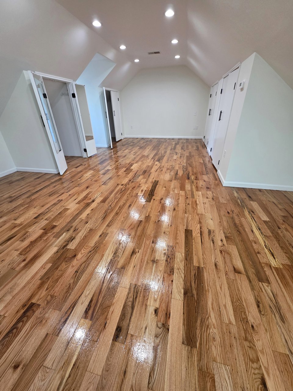 Wood grain and light reflections along a hallway