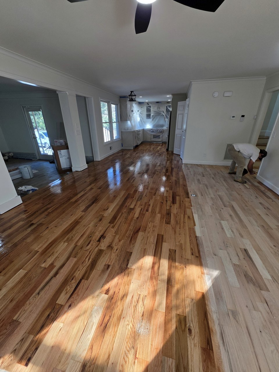 Wood grain across a bright open living area