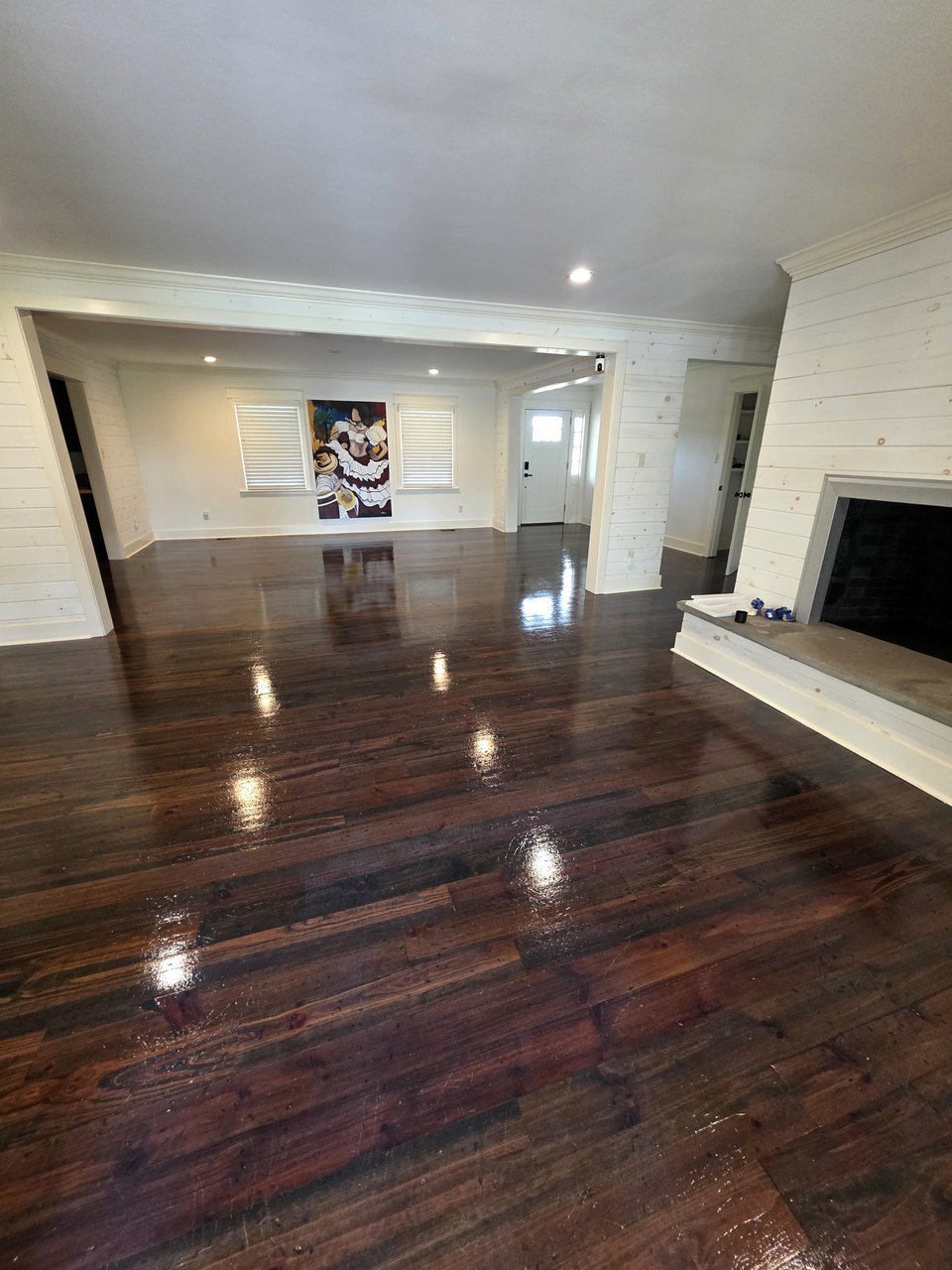 Finished floor reflecting recessed ceiling lights