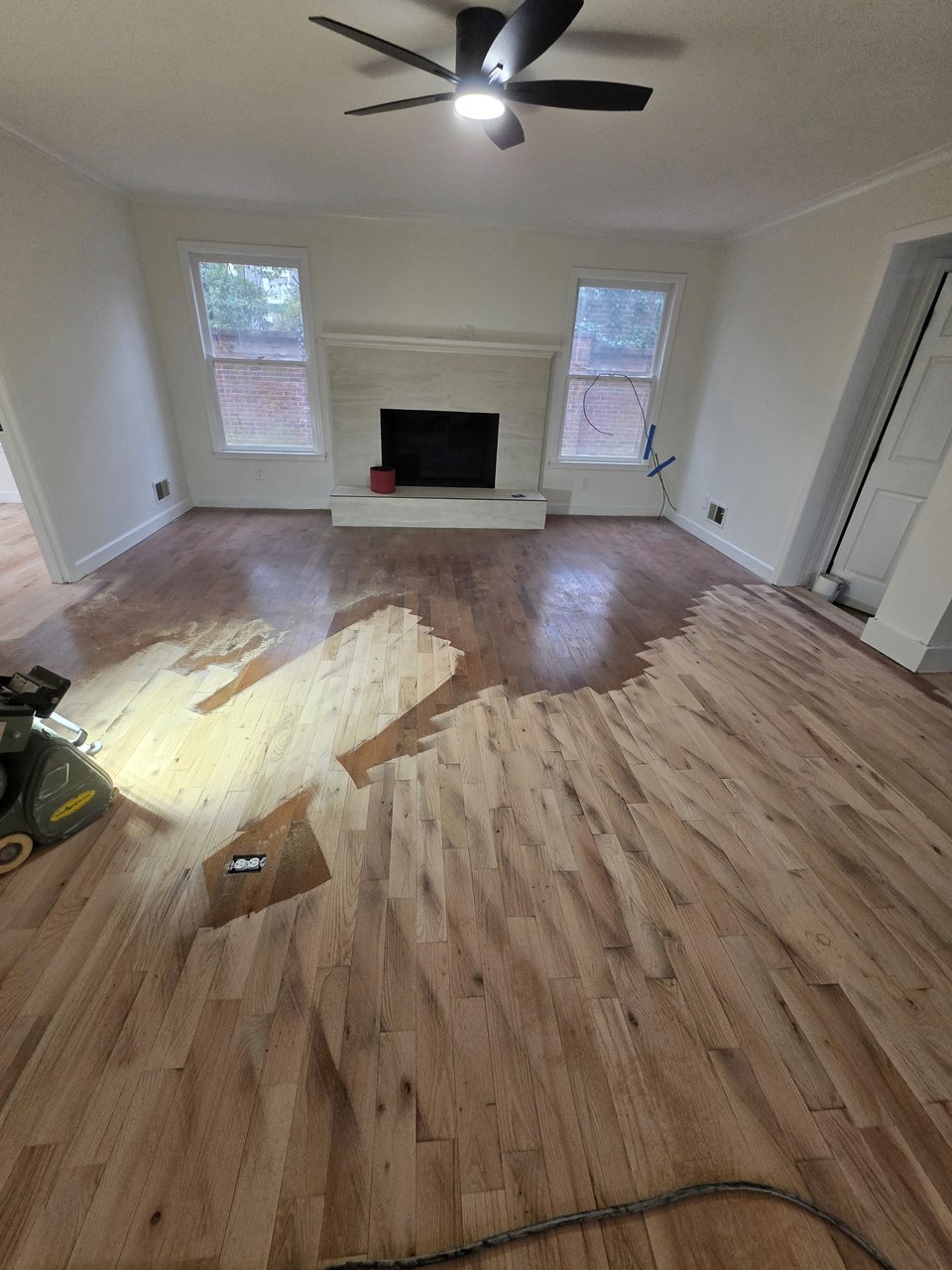 Wood floor with sanding in progress