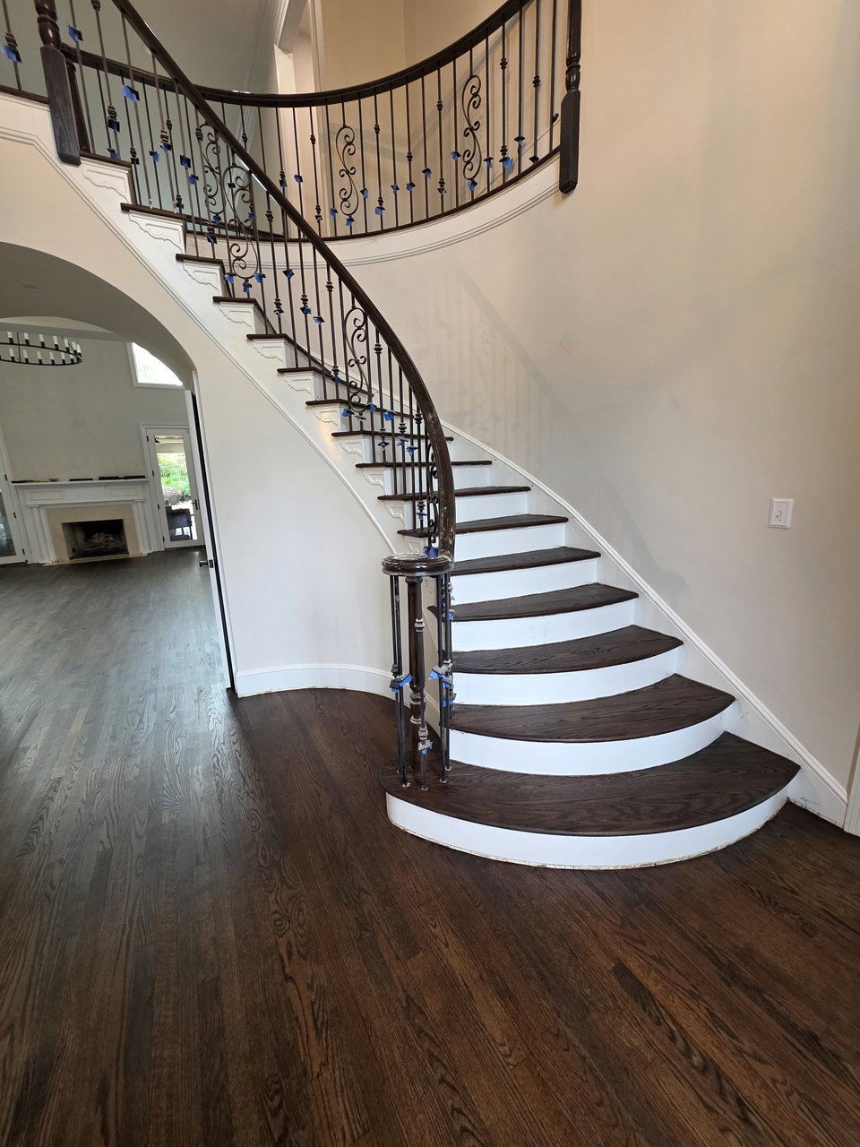 Dark staircase treads curving toward a landing